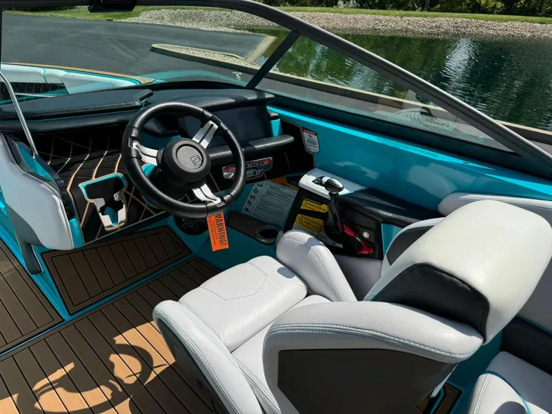 Slide: The Image of 2017 Nautique Super Air Nautique GS22 interior with sleek design and modern controls. - 9