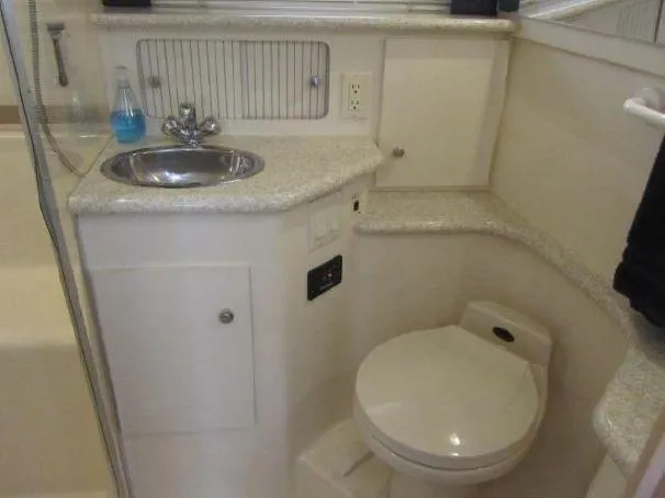 Slide: The Image of 2000 Carver 404 Cockpit Motor Yacht bathroom with sink and toilet. - 20