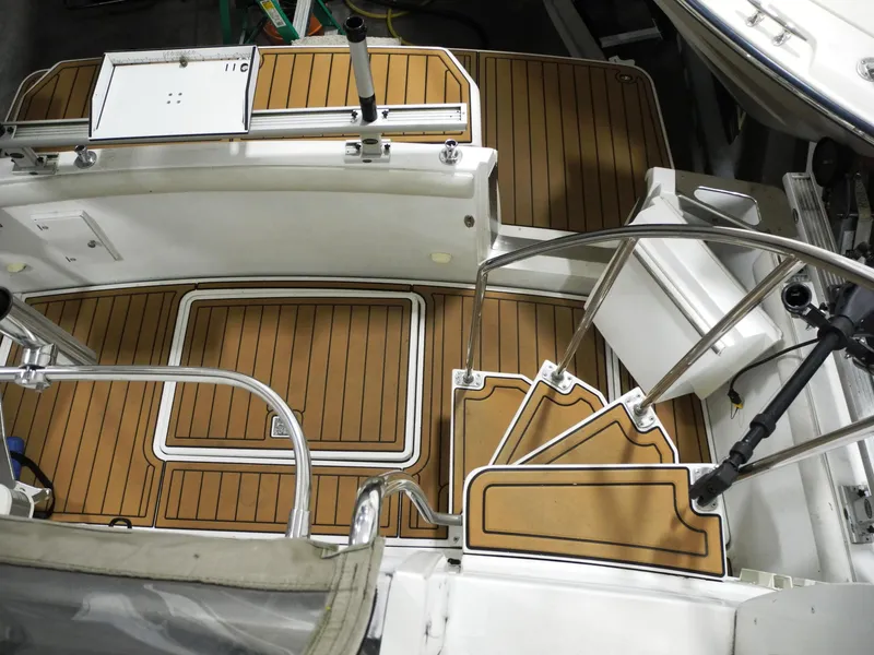 Slide: The Image of 2000 Carver 404 Cockpit Motor Yacht with teak flooring and stainless steel railings. - 5