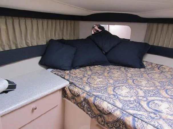 Slide: The Image of Interior cabin of 2000 Carver 404 Cockpit Motor Yacht with bed and pillows. - 16