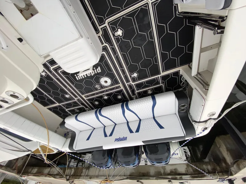 Slide: The Image of 2008 Intrepid 390 Sport Yacht with custom seating and black hexagonal deck design. - 12