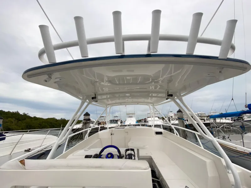 Slide: The Image of 2008 Intrepid 390 Sport Yacht at marina, view of helm and seating area. - 13