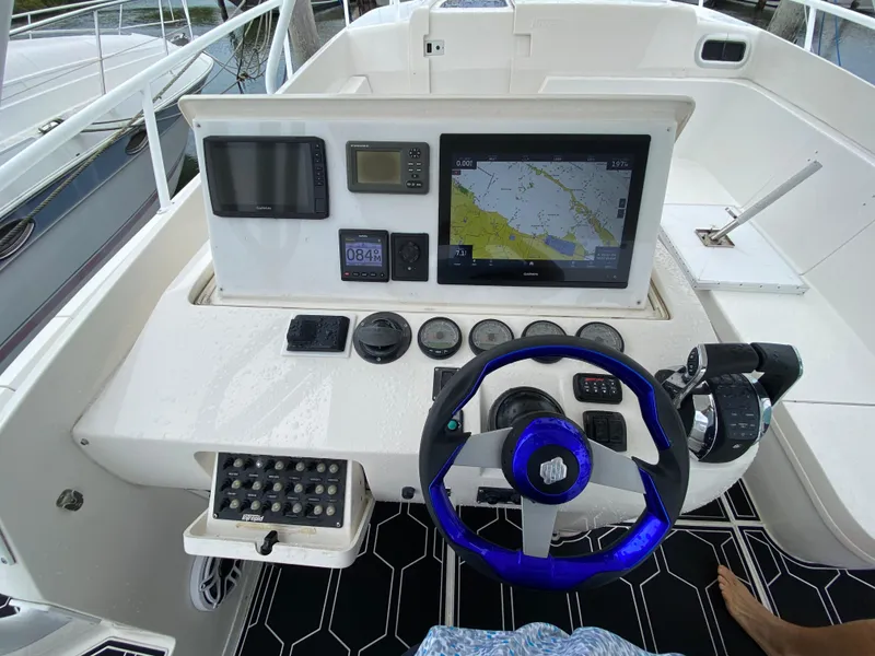 Slide: The Image of Helm of a 2008 Intrepid 390 Sport Yacht with navigation equipment. - 15
