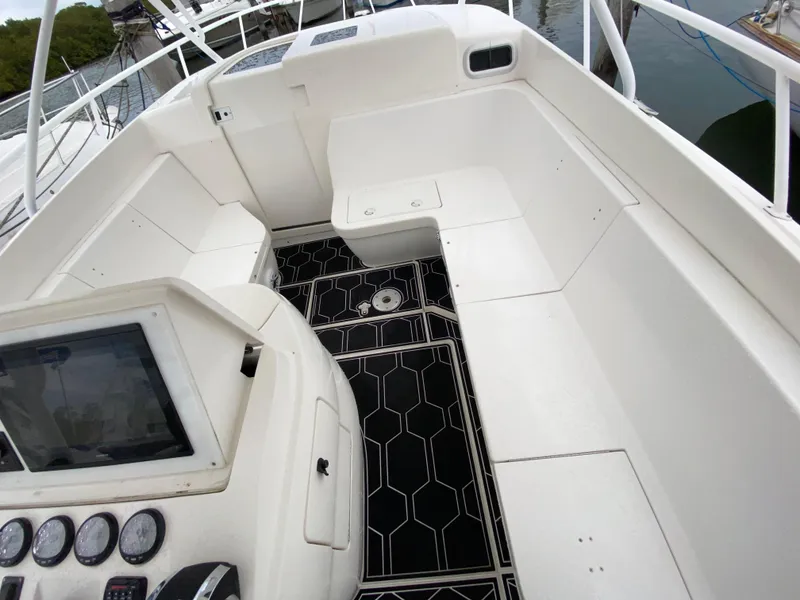 Slide: The Image of 2008 Intrepid 390 Sport Yacht cockpit with seating and navigation controls. - 17