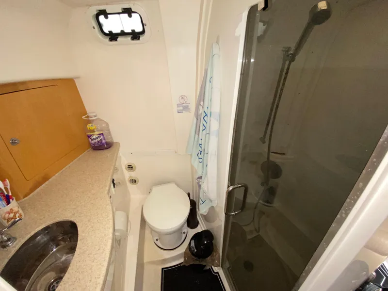 Slide: The Image of 2008 Intrepid 390 Sport Yacht bathroom with shower, sink, and toilet. - 20