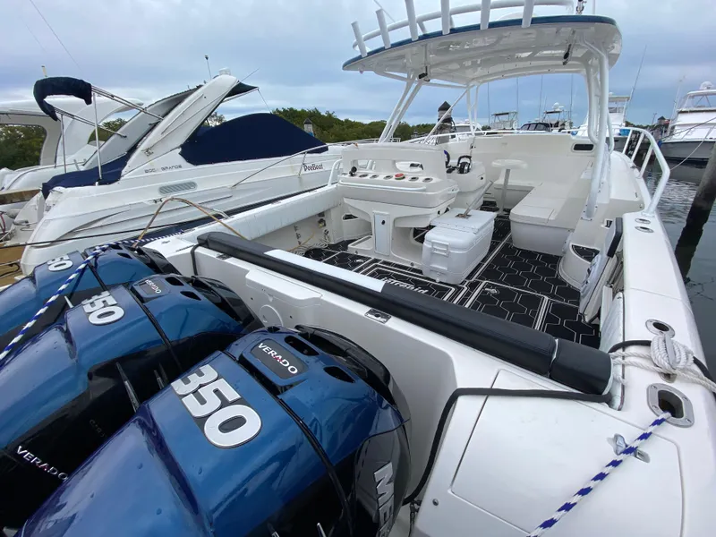 Slide: The Image of 2008 Intrepid 390 Sport Yacht with twin 350 Verado engines docked at marina. - 25
