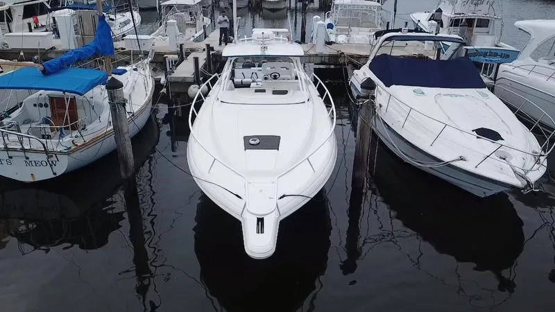 Slide: The Image of 2008 Intrepid 390 Sport Yacht docked between two boats. - 3