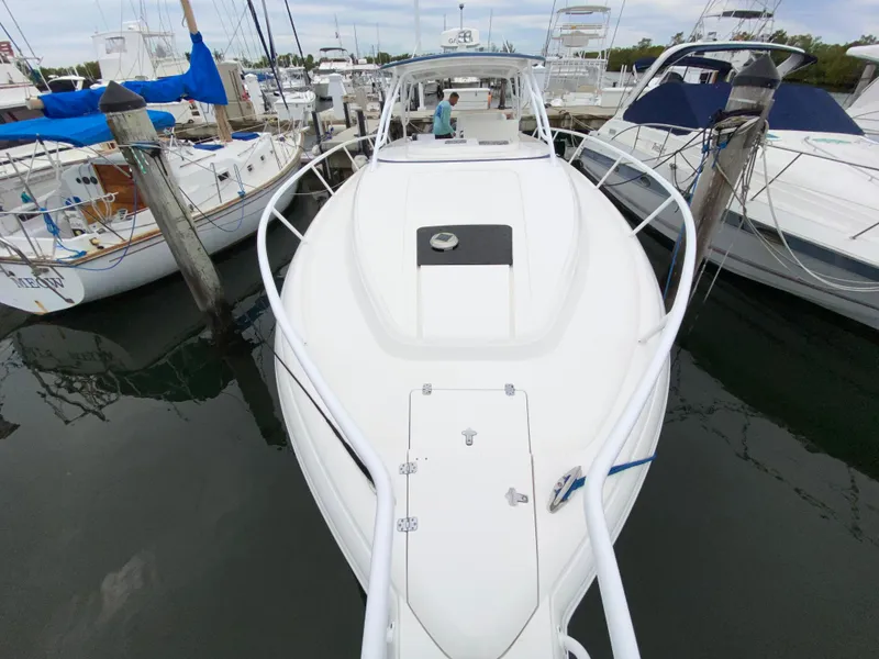 Slide: The Image of 2008 Intrepid 390 Sport Yacht docked at a marina. - 6