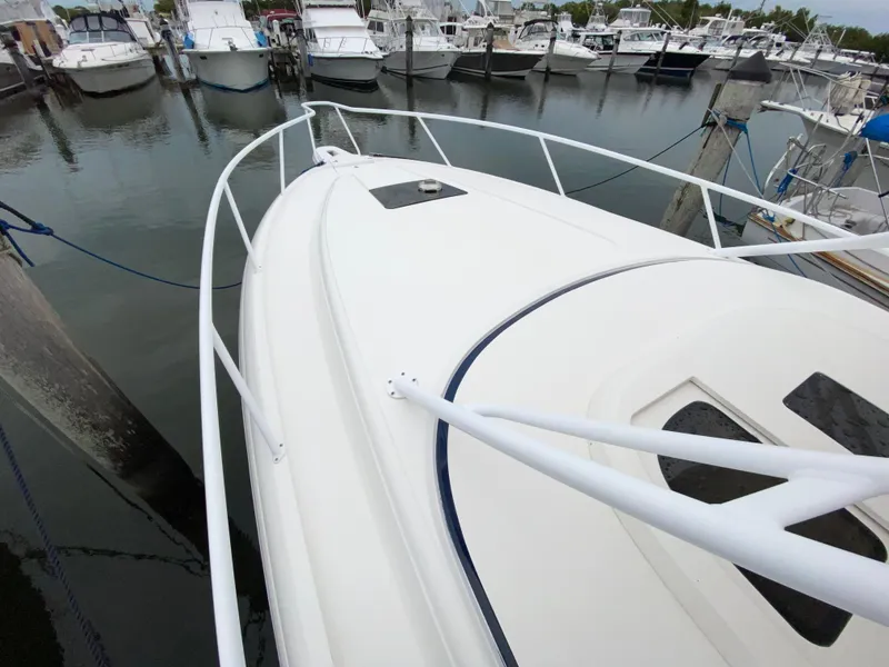 Slide: The Image of 2008 Intrepid 390 Sport Yacht docked at a marina. - 7