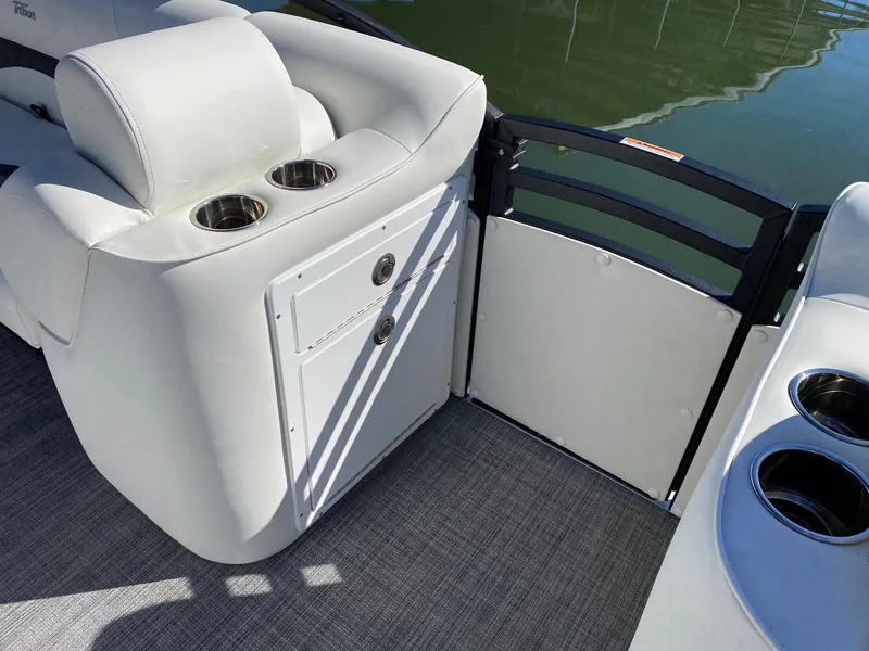 Slide: The Image of 2024 JC Neptoon Sport 23TT boat interior with cup holders and seating. - 10