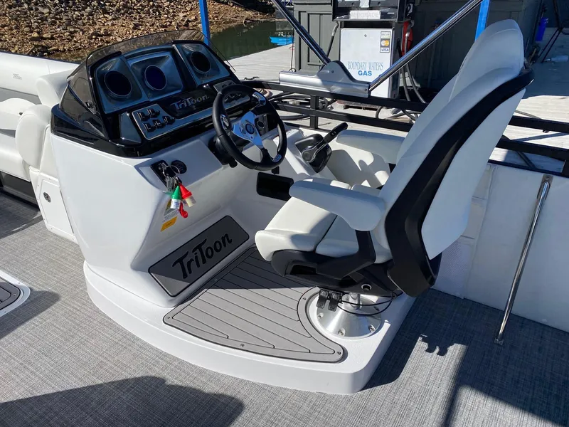 Slide: The Image of Captain's seat and helm of 2024 JC Neptoon Sport 23TT pontoon boat. - 13