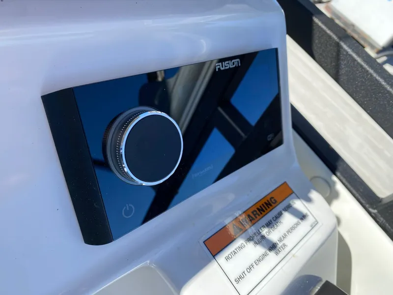 Slide: The Image of Close-up of the 2024 JC Neptoon Sport 23TT control panel with Fusion audio system. - 17