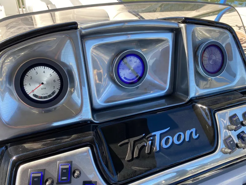 Slide: The Image of Dashboard of 2024 JC Neptoon Sport 23TT pontoon boat with TriToon branding. - 18