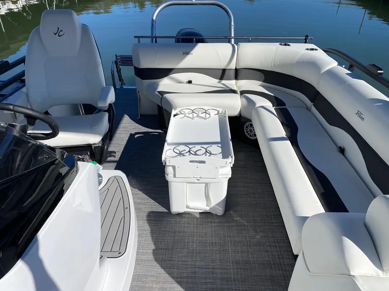 Slide: The Image of 2024 JC Neptoon Sport 23TT pontoon boat interior with seating and cooler. - 20