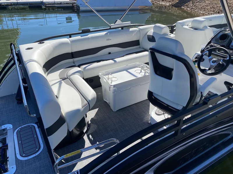 Slide: The Image of 2024 JC Neptoon Sport 23TT pontoon boat interior with seating and steering console. - 21