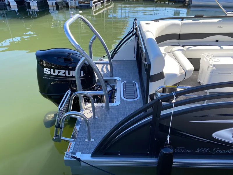 Slide: The Image of 2024 JC Neptoon Sport 23TT pontoon boat with Suzuki outboard motor. - 22
