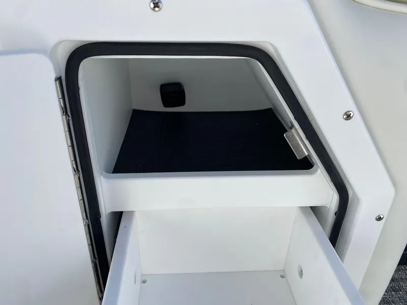 Slide: The Image of 2024 JC Neptoon Sport 23TT storage compartment with open drawer. - 9