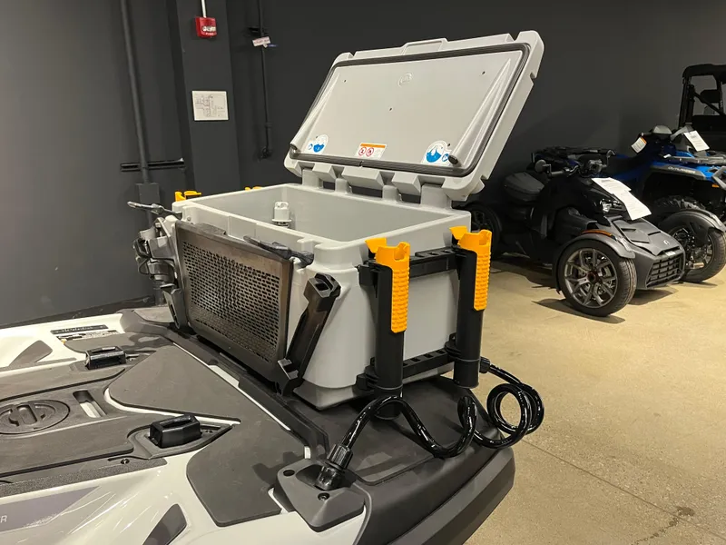 Slide: The Image of 2024 Sea-Doo Fishpro Trophy 170 with open storage compartment in showroom. - 9