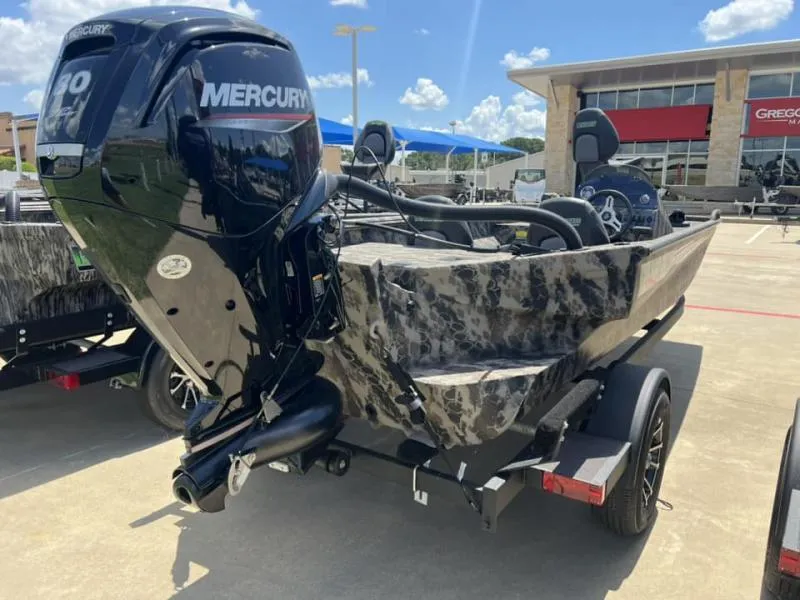 Slide: The Image of 2024 Havoc Boats 1756 FRRSCST with Mercury engine, parked outdoors. - 4