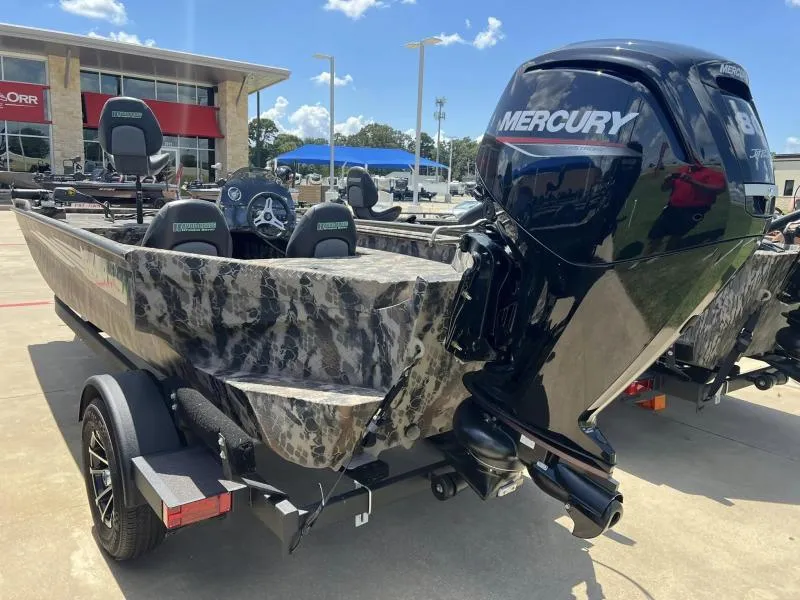 Slide: The Image of 2024 Havoc Boats 1756 FRRSCST with Mercury engine, parked outdoors. - 5