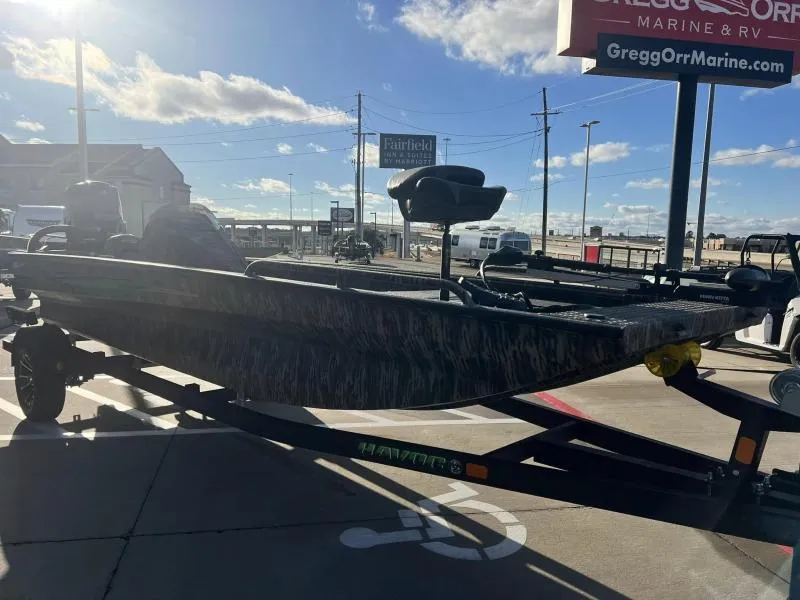 Slide: The Image of 2024 Havoc Boats 1856 FRRSC on trailer at dealership under sunny sky. - 6