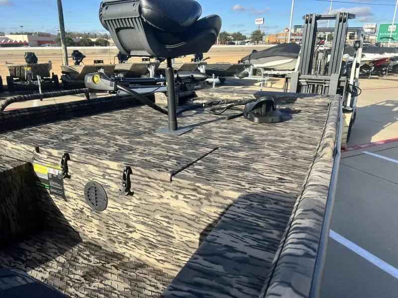 Slide: The Image of 2024 Havoc Boats 1856 FRRSC camo-pattern deck with mounted seat and equipment. - 7