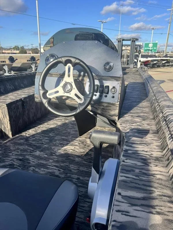 Slide: The Image of 2024 Havoc Boats 1856 FRRSC steering console and interior view. - 8