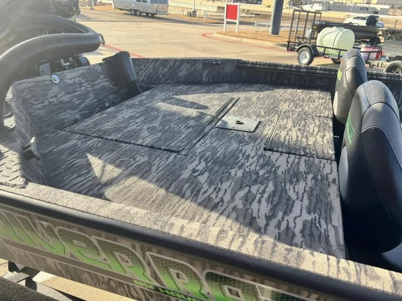 Slide: The Image of 2024 Havoc Boats 1856 FRRSC interior with camo pattern and dual seats. - 9