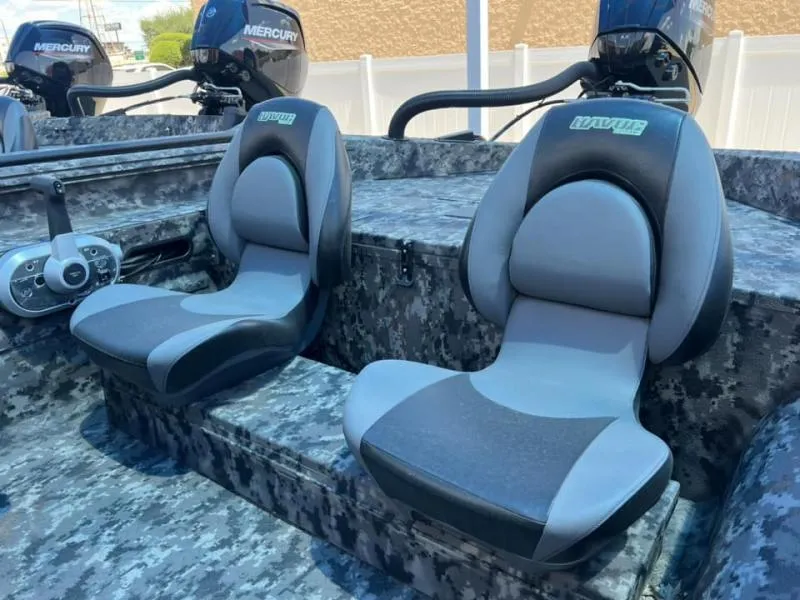 Slide: The Image of 2024 Havoc Boats 1756 FRRSCST interior with dual seats and Mercury engines. - 5