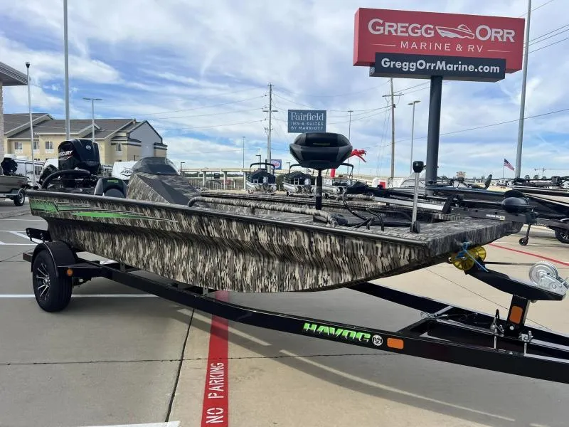 Slide: The Image of 2024 Havoc Boats 1756 FRRSC camo boat on trailer at Gregg Orr Marine & RV dealership. - 6
