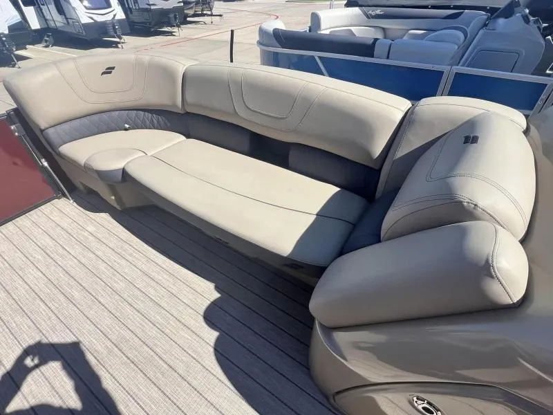 Slide: The Image of 2023 Starcraft SLS-5 Q DH boat interior with beige seating. - 14
