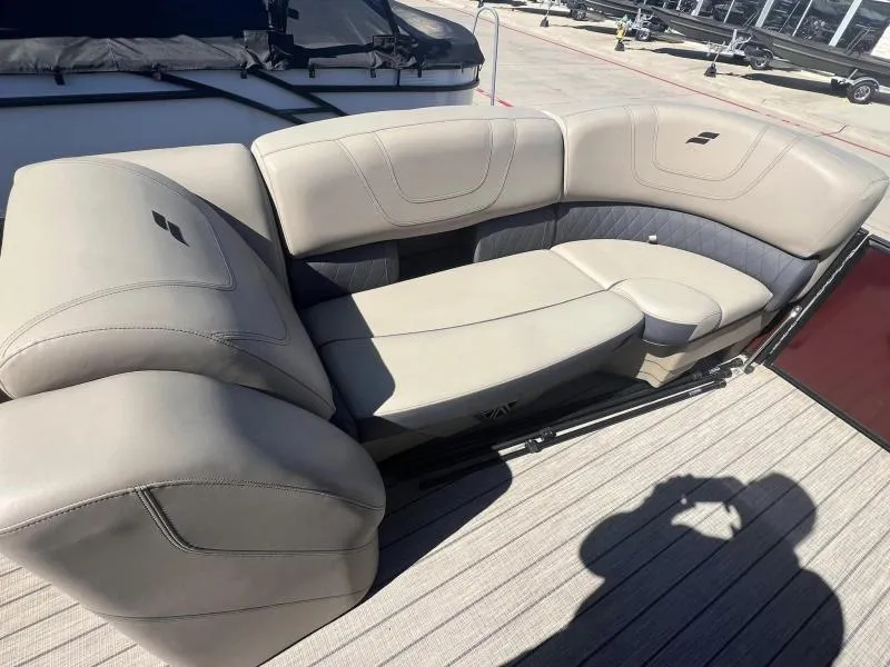 Slide: The Image of 2023 Starcraft SLS-5 Q DH boat interior with beige seating. - 15