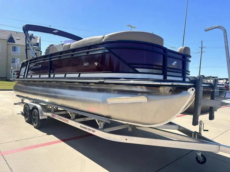 Slide: The Image of 2023 Starcraft SLS-5 Q DH pontoon boat on trailer in parking lot. - 6