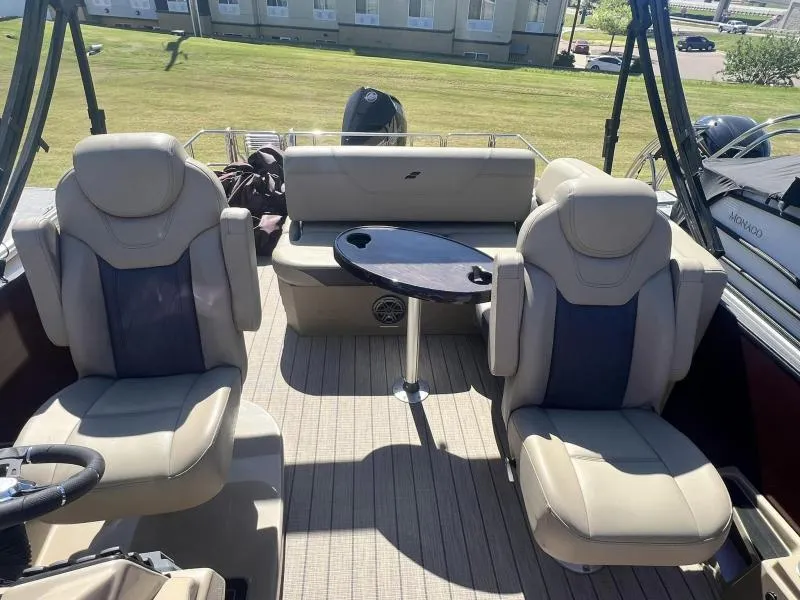 Slide: The Image of 2023 Starcraft SLS-5 Q DH boat interior with beige seats and a small table. - 8