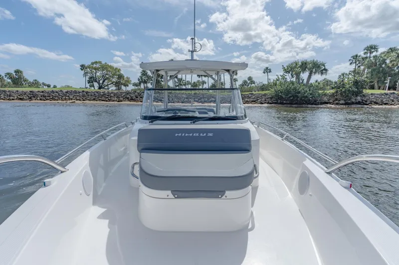 Slide: The Image of 2024 Nimbus Tender 9 #130 boat on calm water with clear sky. - 11