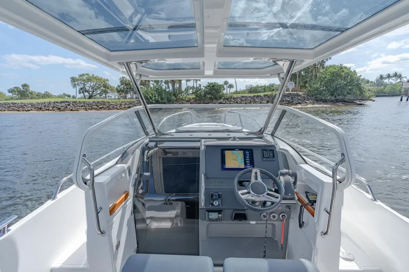 Slide: The Image of Cockpit view of 2024 Nimbus Tender 9 #130 boat with modern navigation system. - 13