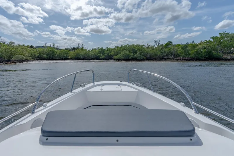 Slide: The Image of Bow view of 2024 Nimbus Tender 9 #130 boat on calm water. - 14