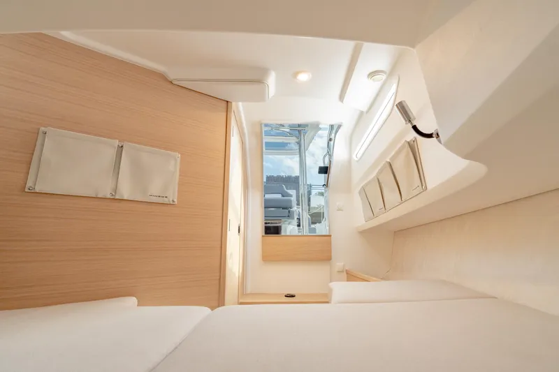 Slide: The Image of 2024 Nimbus Tender 9 #130 interior cabin with modern design and natural light. - 15