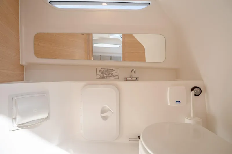 Slide: The Image of Modern bathroom in 2024 Nimbus Tender 9 #130 boat with mirror and compact design. - 16
