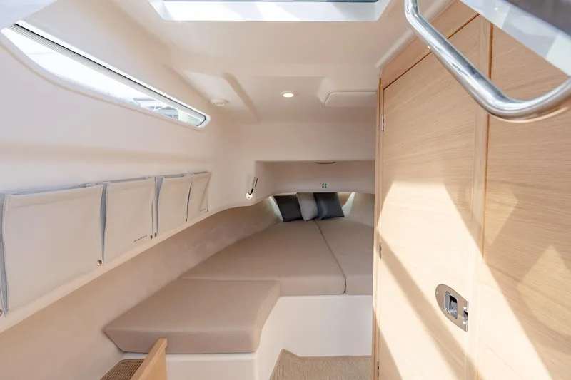Slide: The Image of 2024 Nimbus Tender 9 #130 cabin interior with cozy bed and modern design. - 17