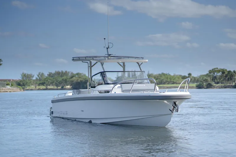 Slide: The Image of 2024 Nimbus Tender 9 #130 boat on calm water with clear sky. - 2