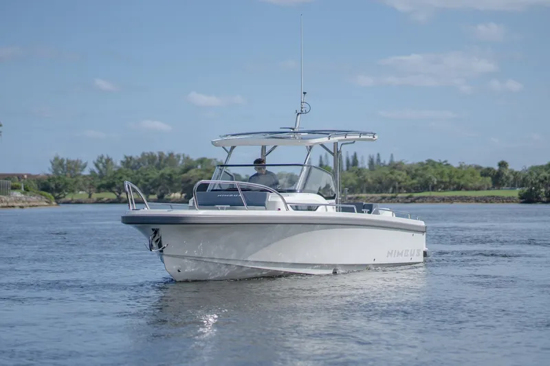 Slide: The Image of 2024 Nimbus Tender 9 #130 boat cruising on a calm lake. - 3