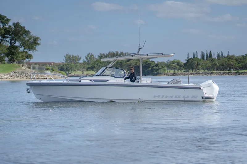 Slide: The Image of 2024 Nimbus Tender 9 #130 boat cruising on a calm lake. - 4