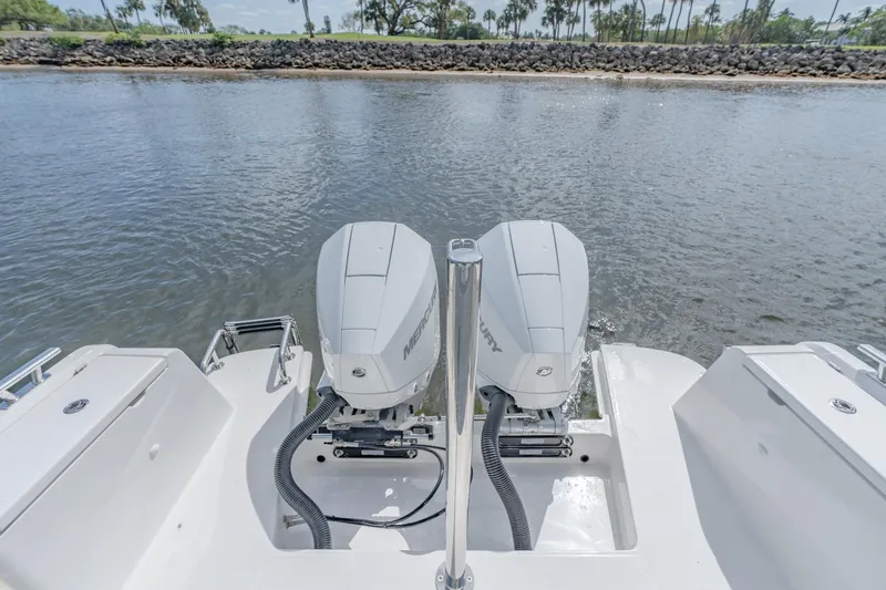 Slide: The Image of 2024 Nimbus Tender 9 #130 with dual Mercury outboard engines on water. - 8