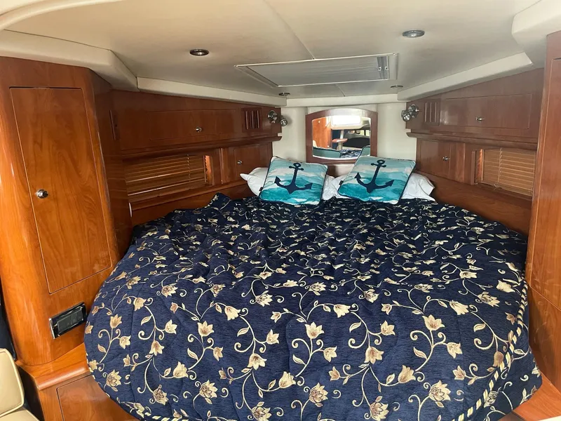 Slide: The Image of Interior of a 2005 Four Winns 348 Vista yacht with cozy bed. - 13