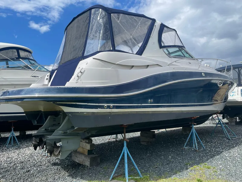 Slide: The Image of 2005 Four Winns 348 Vista boat on stands outdoors. - 3