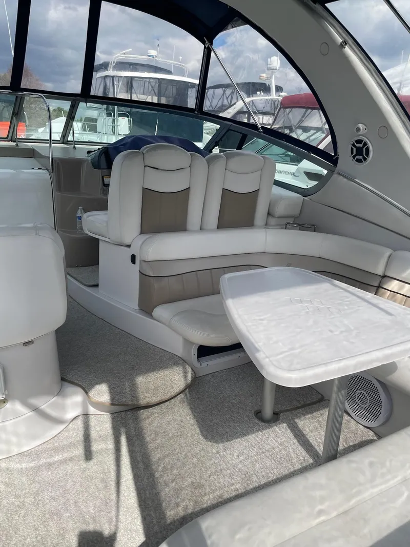 Slide: The Image of Interior of a 2005 Four Winns 348 Vista yacht with seating area. - 5