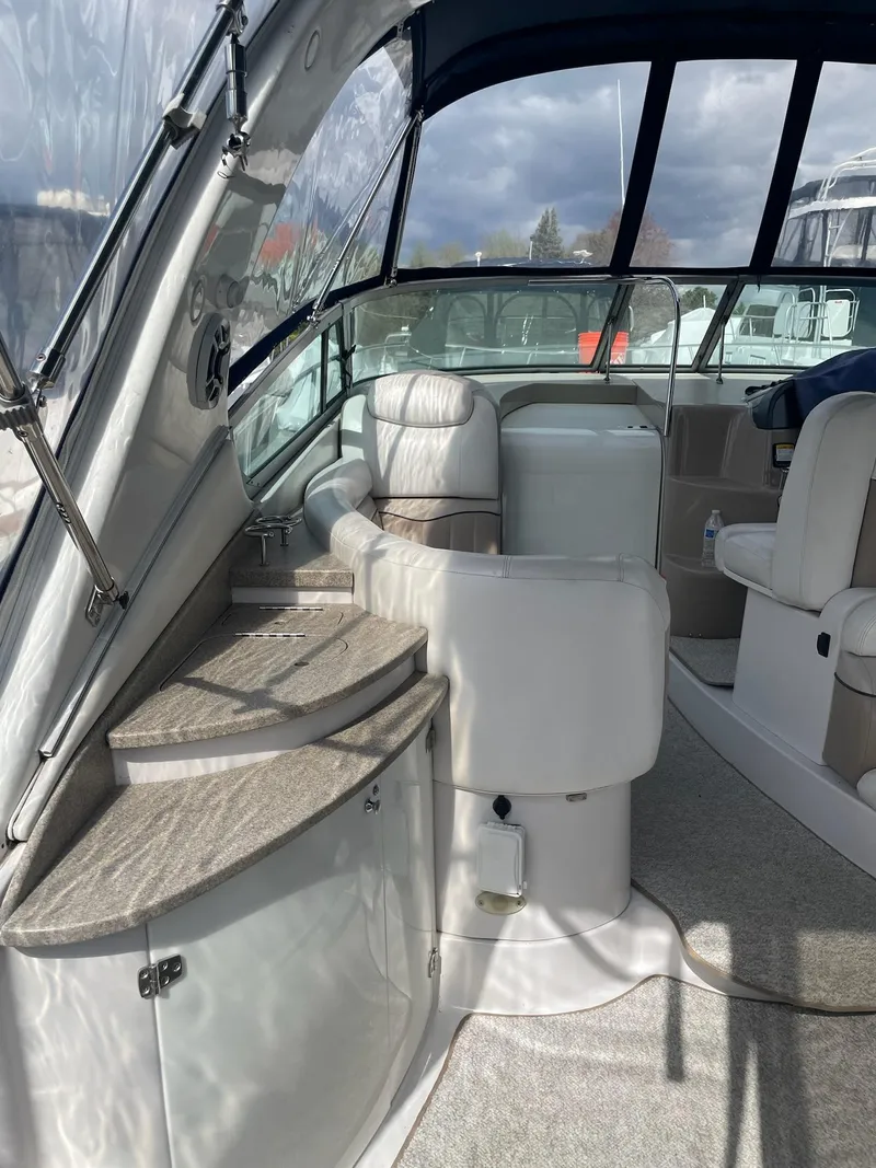 Slide: The Image of Interior of a 2005 Four Winns 348 Vista yacht with seating area. - 6