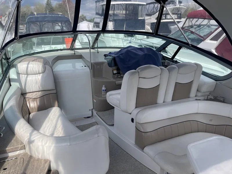 Slide: The Image of Interior of a 2005 Four Winns 348 Vista yacht with white seating. - 7