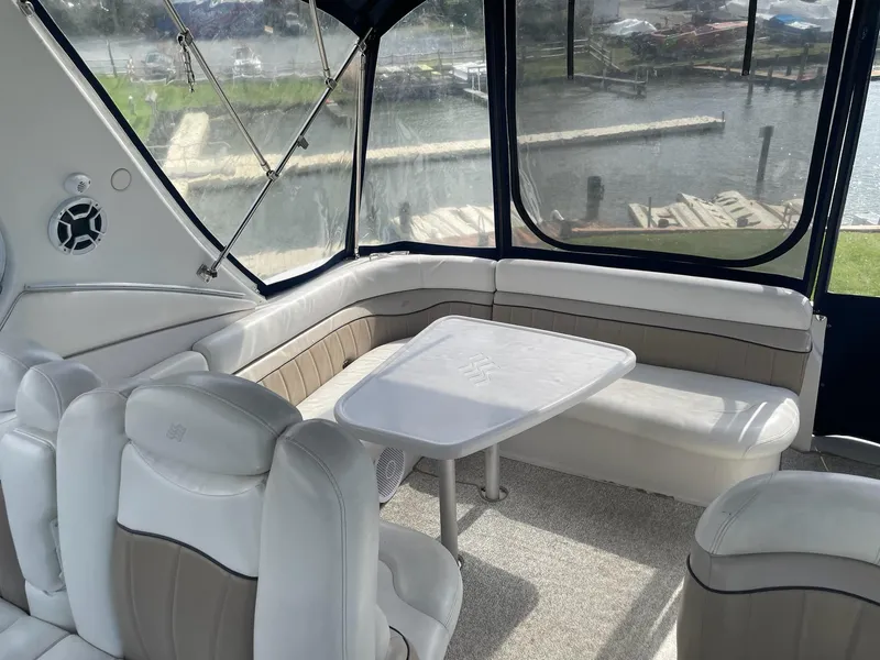 Slide: The Image of 2005 Four Winns 348 Vista boat interior with seating and table. - 8